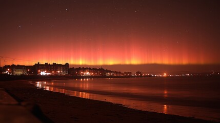 A serene beach scene illuminated by vibrant auroras against a starry night sky.