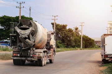 Cement trucks are on their way to pour cement into the work area.
