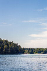 A sunny morning in a Pacific Ocean bay with mountains in the background 