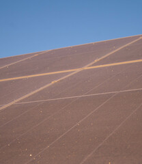 Morning sunlight on frosted solar panels showcasing renewable energy challenges and optimization of...
