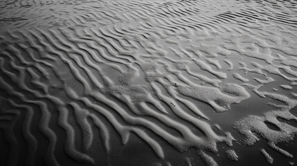 Abstract patterns in the sand.  Concept of nature's artistry, texture, and minimalism.