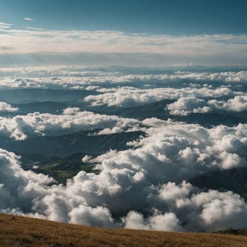 A sky filled with fluffy white clouds over rolling hills.