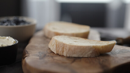 ciabatta bread slice on olive board