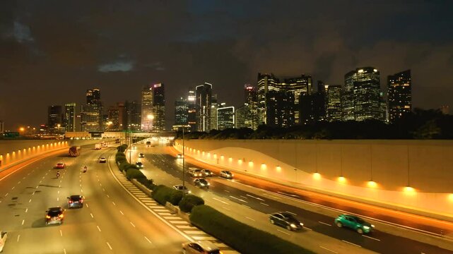 Night scene of Downtown Singapore with Traffic Car City Timelapse. The Marina Coastal Expressway (MCE) is a key underground expressway in Singapore, spanning approximately 5 kilometers. It connects t