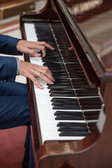 Fototapeta premium The pianist's hands are playing the piano