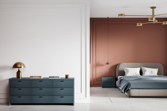 Modern bedroom interior with blue dresser, white and terracotta walls, and cozy bed setup. 3D Rendering