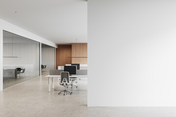 Modern office interior with white and wooden design elements, featuring sleek desks, chairs, and a...