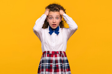 Girl holding her head with both hands