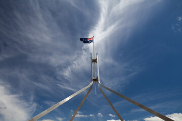 The Australian flag flying on top of Parliament House in Canberra.