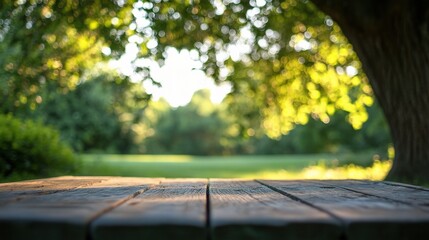 Naklejka premium Empty Wooden Table in a Blurred Green Forest Background