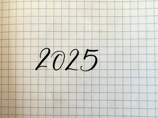 New Year 2025 handwritten numbers on paper 