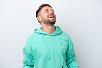 Fototapeta premium Young caucasian man isolated on white background laughing