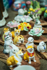 Obraz premium Charming Collection of Ceramic Animal Figurines and Decorative Flowers