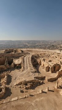 Aerial view of the Herodium in Israel on a sunny and clear day, showcasing the ancient ruins and breathtaking landscape of this UNESCO World Heritage Site. summer sun