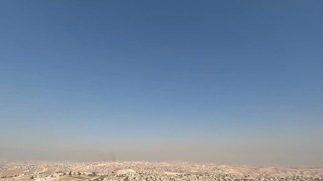 A stunning view from Herodium, overlooking the Judean Mountains and surrounding settlements, capturing the beautiful landscape and ancient ruins of this UNESCO World Heritage Site.