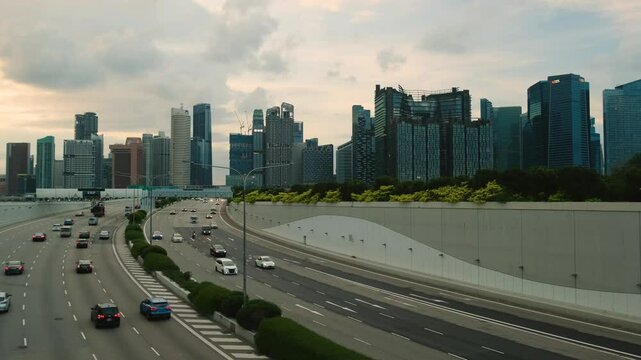Sunset Scene of Downtown Singapore with Traffic Car City Timelapse. The Marina Coastal Expressway (MCE) is a key underground expressway in Singapore, spanning approximately 5 kilometres.