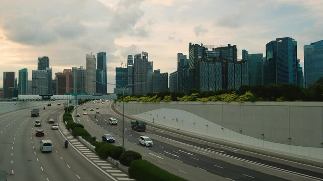 Sunset Scene of Downtown Singapore with Traffic Car City Timelapse. The Marina Coastal Expressway (MCE) is a key underground expressway in Singapore, spanning approximately 5 kilometres.