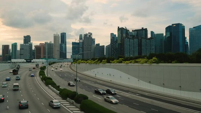Sunset Scene of Downtown Singapore with Traffic Car City Timelapse. The Marina Coastal Expressway (MCE) is a key underground expressway in Singapore, spanning approximately 5 kilometres.
