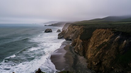 Rugged cliffs meet the restless ocean under a misty sky, embodying nature’s raw power and serene beauty in dramatic harmony.