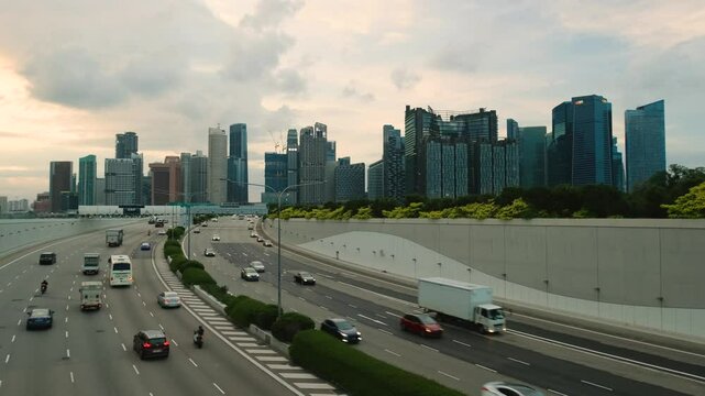 Sunset Scene of Downtown Singapore with Traffic Car City Timelapse. The Marina Coastal Expressway (MCE) is a key underground expressway in Singapore, spanning approximately 5 kilometres.