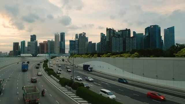 Sunset Scene of Downtown Singapore with Traffic Car City Timelapse. The Marina Coastal Expressway (MCE) is a key underground expressway in Singapore, spanning approximately 5 kilometres.