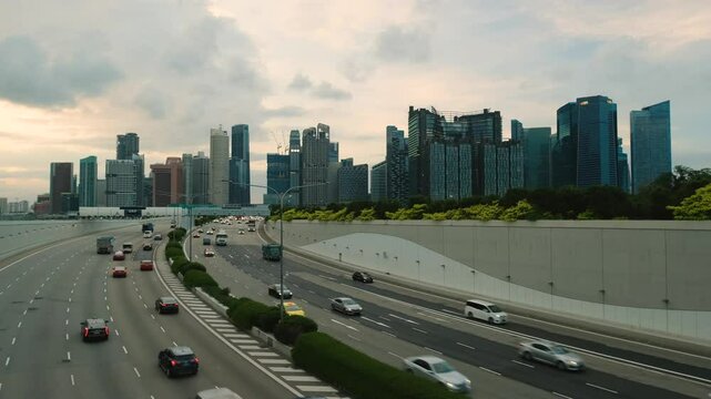 Sunset Scene of Downtown Singapore with Traffic Car City Timelapse. The Marina Coastal Expressway (MCE) is a key underground expressway in Singapore, spanning approximately 5 kilometres.
