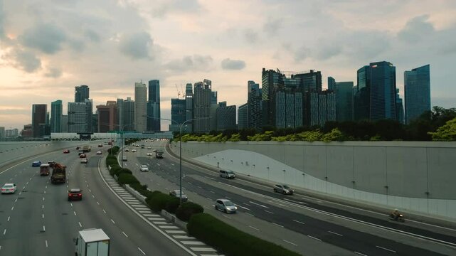 Sunset Scene of Downtown Singapore with Traffic Car City Timelapse. The Marina Coastal Expressway (MCE) is a key underground expressway in Singapore, spanning approximately 5 kilometres.