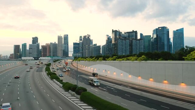 Sunset Scene of Downtown Singapore with Traffic Car City Timelapse. The Marina Coastal Expressway (MCE) is a key underground expressway in Singapore, spanning approximately 5 kilometres.