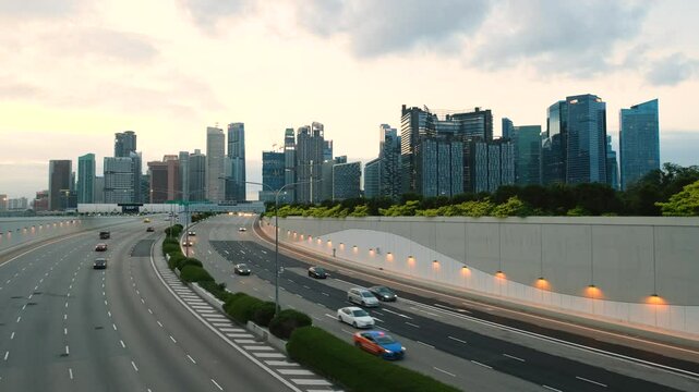 Sunset Scene of Downtown Singapore with Traffic Car City Timelapse. The Marina Coastal Expressway (MCE) is a key underground expressway in Singapore, spanning approximately 5 kilometres.