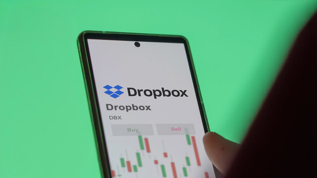 Dropbox on a white wall in a hall building, the $DBX brand indoor.