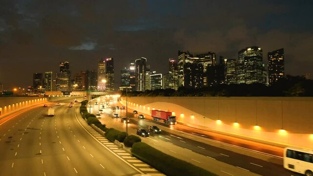 Night Scene of Downtown Singapore with Traffic Car City Timelapse. The Marina Coastal Expressway (MCE) is a key underground expressway in Singapore, spanning approximately 5 kilometres.