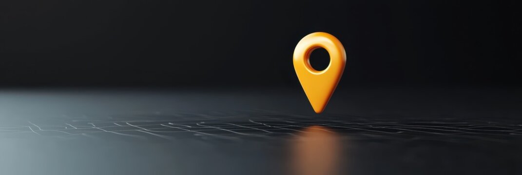 Glossy glowing gold location marker shines brightly on a sleek black surface