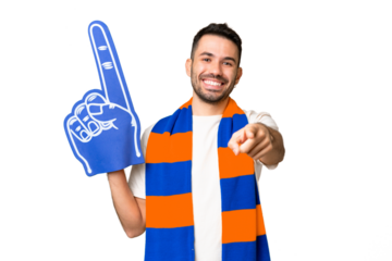 Young caucasian sports fan man over isolated chroma key background pointing front with happy expression