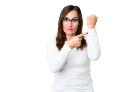 Middle age woman over isolated chroma key background making the gesture of being late