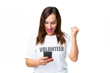 Middle age volunteer woman over isolated chroma key background surprised and sending a message