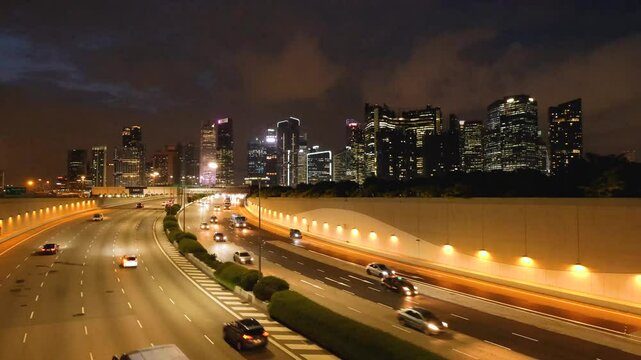 Night Scene of Downtown Singapore with Traffic Car City Timelapse. The Marina Coastal Expressway (MCE) is a key underground expressway in Singapore, spanning approximately 5 kilometres.