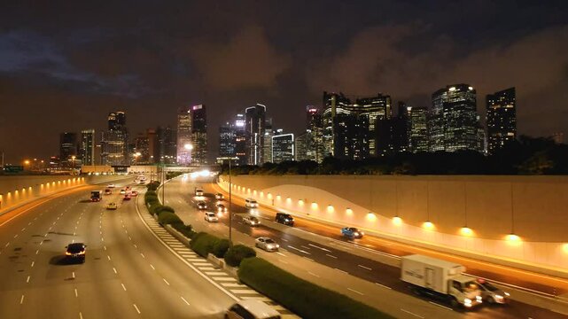 Night Scene of Downtown Singapore with Traffic Car City Timelapse. The Marina Coastal Expressway (MCE) is a key underground expressway in Singapore, spanning approximately 5 kilometres.