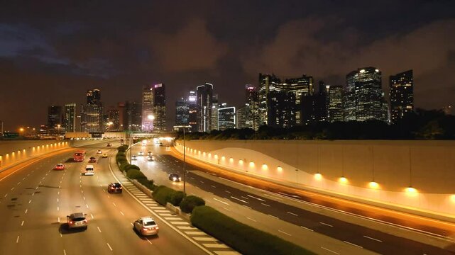 Night Scene of Downtown Singapore with Traffic Car City Timelapse. The Marina Coastal Expressway (MCE) is a key underground expressway in Singapore, spanning approximately 5 kilometres.