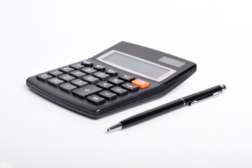 Black Calculator with pen isolated on white background. Financial activity, accounting, tax calculation or saving and investment