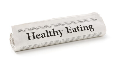 Rolled newspaper with the headline