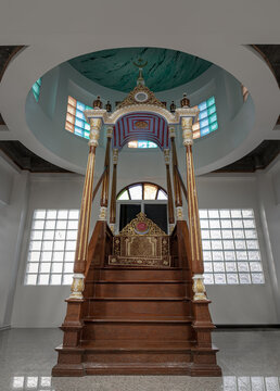Ornately decorated minbar pulpit from where prayers are led standing on a platform at Safirusslam Mosque. Islamic Affairs, use it as your Wallpaper, Poster and Space for text. Selective focus.
