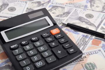 Calculator isolated on dollars background. Tax season concept. Tax planning and consulting service business