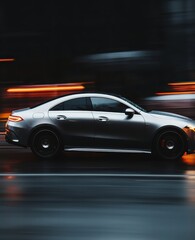 Fototapeta premium Silver Luxury Car in Motion on Rainy City Street at Night