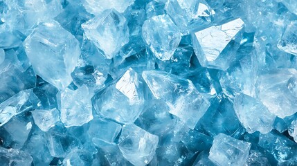 Obraz premium A glimmering crystal texture with sharp, reflective facets in shades of light blue and clear, giving the appearance of a diamond-like clarity