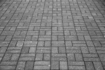 Empty grey tiled floor, pavement in perspective on modern architecture background. Abstract concrete glass building, Outdoor observation deck. street urban tile flooring. paving stones. blurred city