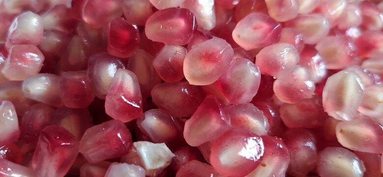 Delicious sweet Pomegranate seeds or buah delima background