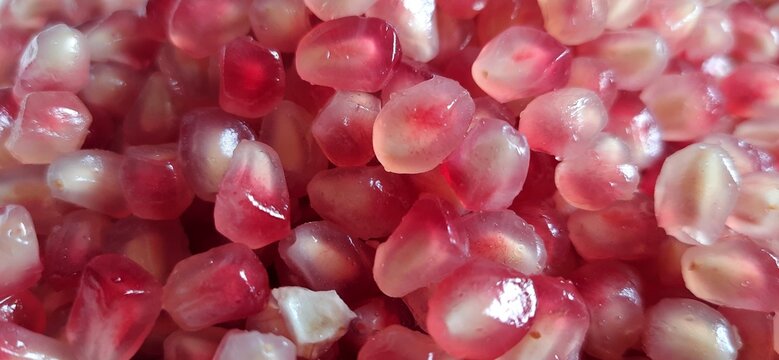 Delicious sweet Pomegranate seeds or buah delima background
