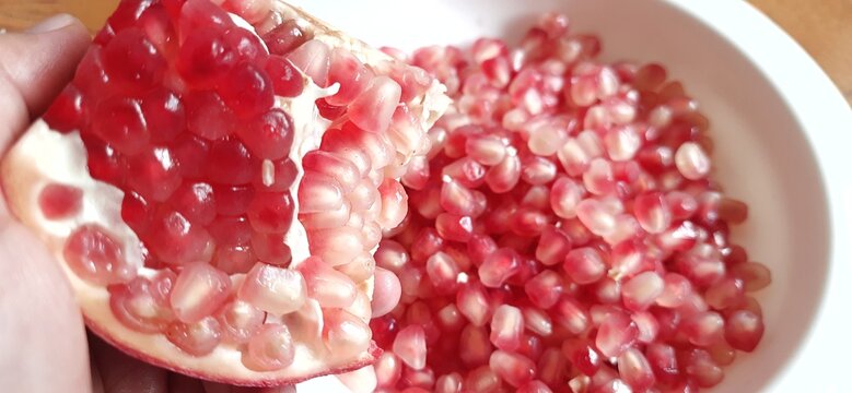 Delicious sweet Pomegranate seeds or buah delima background
