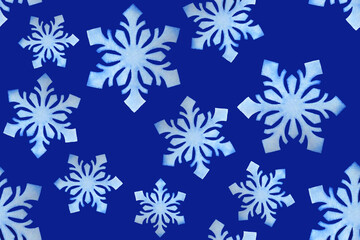 Seamless pattern of watercolor snowflakes on a blue background. Winter Christmas background.