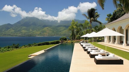 Luxurious tropical villa with infinity pool overlooking a scenic mountain vista.